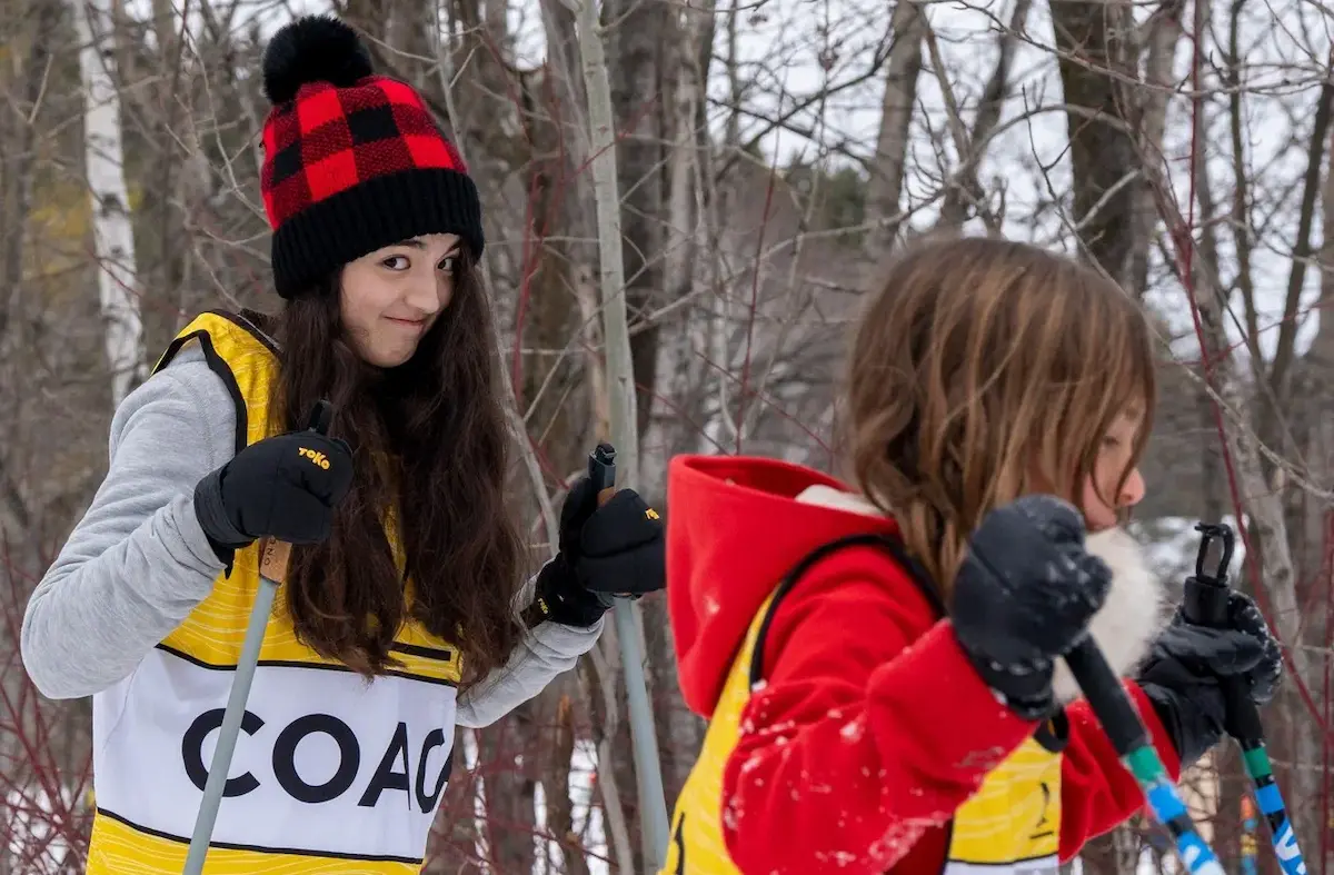 Coaching young skiers to fund camp