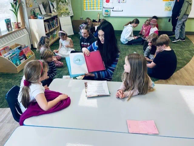 Reading to Forest School children